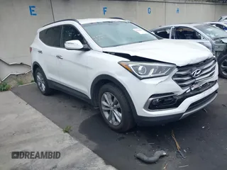 2018 Hyundai Santa Fe 2.0T z VIN 5XYZU4LA5JG527311, wystawiony jako IAAI lot #42358853 z przebiegiem 63 107 mil mil oraz . Historia ofert i sprzedaży dostępna na DreamBid. Obrazek 1.