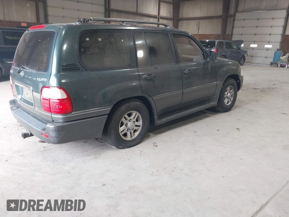 1998 Lexus LX 470 with VIN JT6HT00W3W0001352, listed as a IAAI auction lot 41882901 with 226,917 mi miles and . Bid and sale history available at DreamBid. Image 4.