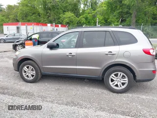 2011 Hyundai Santa Fe GL z VIN 5XYZGDAG6BG065017, wystawiony jako IAAI lot #42255240 z przebiegiem 121 905 mil mil oraz . Historia ofert i sprzedaży dostępna na DreamBid. Obrazek 14.