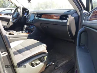 2012 Volkswagen Touareg Sport with VIN WVGFK9BP0CD004951, listed as a IAAI auction lot 42724125 with 173,993 mi miles and . Bid and sale history available at DreamBid. Image 5.