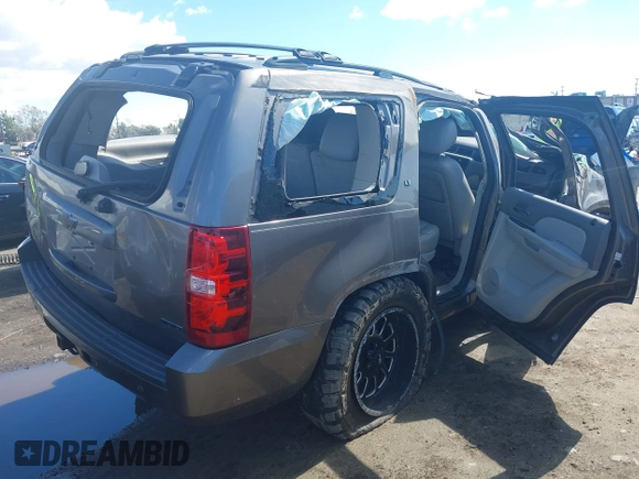 2012 Chevrolet Tahoe LT with VIN 1GNSKBE09CR100385, listed as a IAAI auction lot 41743325 with 185,174 mi miles and . Bid and sale history available at DreamBid. Image 4.