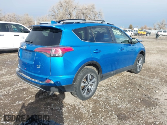 2016 Toyota RAV4 XLE with VIN JTMRFREV4GD186580, listed as a IAAI auction lot 40916703 with 117,120 mi miles and . Bid and sale history available at DreamBid. Image 4.