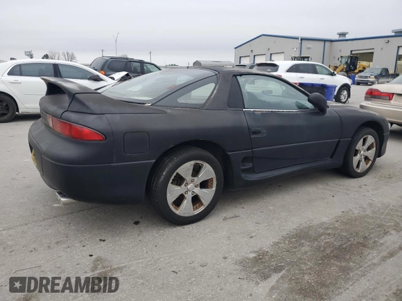 1998 Mitsubishi 3000GT z VIN JA3AM44H8WY000594, wystawiony jako Copart lot #44164155 z przebiegiem 92 227 mil mil oraz Czysty tytuł • Clean title. Historia ofert i sprzedaży dostępna na DreamBid. Obrazek 3.