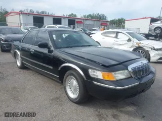 1999 Mercury Grand Marquis LS with VIN 2MEFM75W8XX645350, listed as a IAAI auction lot 40713217 with 56,271 mi miles. Bid and sale history available at carsss.com. Image 1.