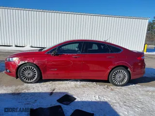 2014 Ford Fusion Titanium Hybrid with VIN 3FA6P0RUXER289087, listed as a IAAI auction lot 41418491 with 126,849 mi miles. Bid and sale history available at carsss.com. Image 14.