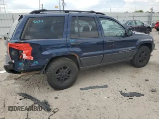 2004 Jeep Grand Cherokee Laredo with VIN 1J4GW48S04C125931, listed as a Copart auction lot 59972695 with 198,403 mi miles and Salvage title. Bid and sale history available at DreamBid. Image 3.