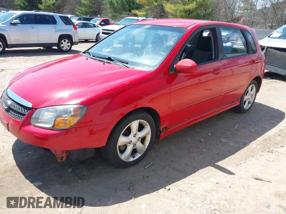 2009 Kia Spectra with VIN KNAFE241995024997, listed as a IAAI auction lot 42095812 with 217,555 mi miles. Bid and sale history available at carsss.com. Image 2.
