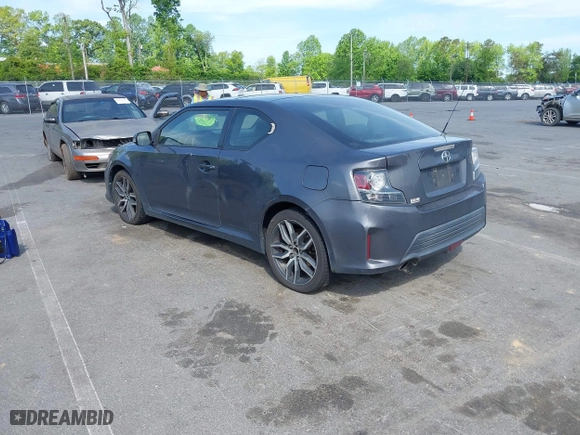 2015 Scion tC with VIN JTKJF5C71FJ013747, listed as a IAAI auction lot 42087740 with 138,097 mi miles. Bid and sale history available at carsss.com. Image 3.
