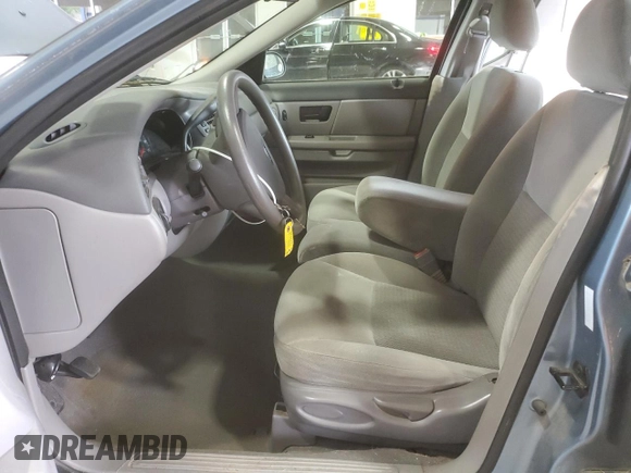 2007 Ford Taurus SE with VIN 1FAFP53U17A215432, listed as a Copart auction lot 64029215 with 121,190 mi miles and Salvage title. Bid and sale history available at DreamBid. Image 7.