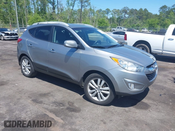 2013 Hyundai Tucson GLS with VIN KM8JU3AC4DU588062, listed as a IAAI auction lot 42080348 with 76,937 mi miles. Bid and sale history available at carsss.com. Image 1.