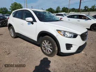 2016 Mazda CX-5 Sport with VIN JM3KE4BYXG0704194, listed as a Copart auction lot 62095735 with 93,970 mi miles and Salvage title. Bid and sale history available at DreamBid. Image 4.