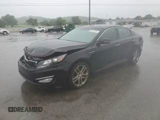 2013 Kia Optima SX z VIN 5XXGR4A69DG189654, wystawiony jako Copart lot #60129135 z przebiegiem 83 586 mil mil oraz Czysty tytuł • Clean title. Historia ofert i sprzedaży dostępna na DreamBid. Obrazek 1.