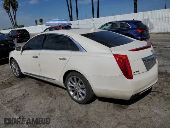 2014 Cadillac XTS Premium with VIN 2G61P5S36E9305491, listed as a Copart auction lot 44404425 with 104,710 mi miles and Salvage Title. Bid and sale history available at DreamBid. Image 2.