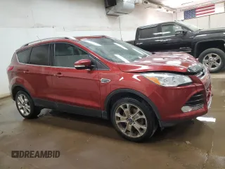 2016 Ford Escape Titanium with VIN 1FMCU9J95GUC57205, listed as a Copart auction lot 71033934 with 90,477 mi miles and Salvage Title. Bid and sale history available at DreamBid. Image 4.