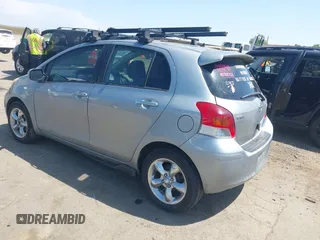 2009 Toyota Yaris with VIN JTDKT903195235991, listed as a IAAI auction lot 42164989 with 249,389 mi miles. Bid and sale history available at carsss.com. Image 3.