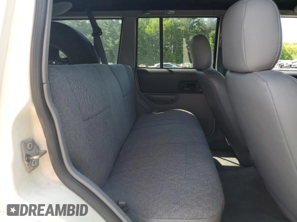 1998 Jeep Cherokee Sport with VIN 1J4FJ68S8WL116368, listed as a Copart auction lot 59228735 with 113,546 mi miles and Salvage title. Bid and sale history available at DreamBid. Image 11.