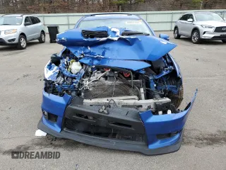 2015 Mitsubishi Lancer Evolution GSR z VIN JA32W8FV7FU023106, wystawiony jako Copart lot #40867084 z przebiegiem 103 964 mil mil oraz Szkody całkowita. Historia ofert i sprzedaży dostępna na DreamBid. Obrazek 5.