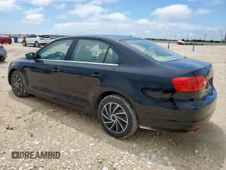 2013 Volkswagen Jetta SE with VIN 3VWDX7AJ3DM434233, listed as a Copart auction lot 60697485 with 74,333 mi miles and Salvage title. Bid and sale history available at DreamBid. Image 2.