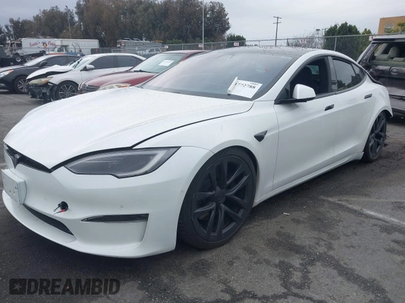 2022 Tesla Model S Plaid with VIN 5YJSA1E65NF488864, listed as a IAAI auction lot 41772788 with 33,915 mi miles and . Bid and sale history available at DreamBid. Image 2.