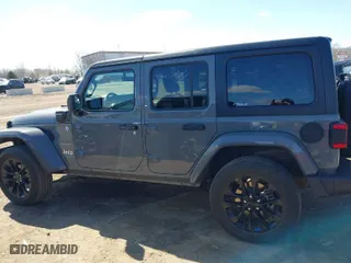 2023 Jeep Wrangler 4xe Sahara with VIN 1C4JJXP62PW696002, listed as a IAAI auction lot 41891127 with 44,567 mi miles. Bid and sale history available at carsss.com. Image 14.