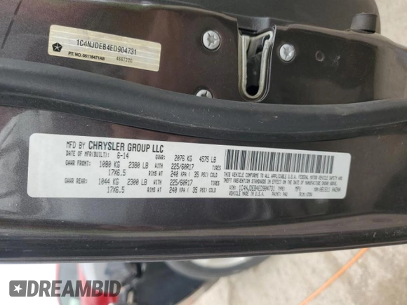 2014 Jeep Compass Latitude with VIN 1C4NJDEB4ED904731, listed as a Copart auction lot 51809165 with 104,760 mi miles and Salvage Title. Bid and sale history available at DreamBid. Image 13.