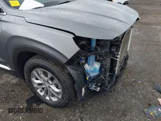 2019 Hyundai Santa Fe SEL z VIN 5NMS3CAD7KH035429, wystawiony jako IAAI lot #42323641 z przebiegiem 60 909 mil mil oraz . Historia ofert i sprzedaży dostępna na DreamBid. Obrazek 20.