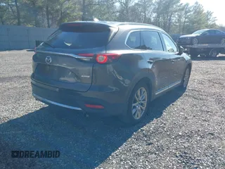 2019 Mazda CX-9 Grand Touring with VIN JM3TCBDY3K0307964, listed as a IAAI auction lot 41706594 with 170,596 mi miles and . Bid and sale history available at DreamBid. Image 4.
