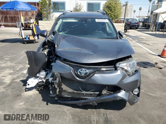 2018 Toyota RAV4 XLE with VIN JTMRFREVXJD251679, listed as a Copart auction lot 49454115 with 48,385 mi miles and Salvage Title. Bid and sale history available at DreamBid. Image 5.