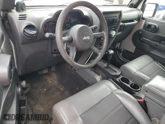 2008 Jeep Wrangler X z VIN 1J4FA24168L629174, wystawiony jako Copart lot #61199205 z przebiegiem 116 307 mil mil oraz Szkoda całkowita • Salvage title. Historia ofert i sprzedaży dostępna na DreamBid. Obrazek 8.