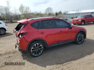 2016 Mazda CX-5 Grand Touring z VIN JM3KE2DY2G0705650, wystawiony jako Copart lot #53808365 z przebiegiem 123 611 mil mil oraz Szkoda całkowita • Salvage title. Historia ofert i sprzedaży dostępna na DreamBid. Obrazek 3.