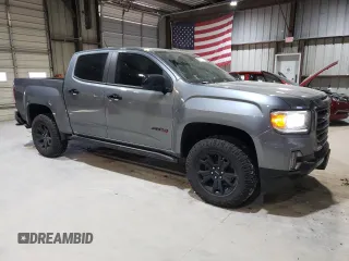 2022 GMC Canyon 4WD AT4 w/Leather with VIN 1GTG6FEN1N1175900, listed as a Copart auction lot 85957514 with 56,811 mi miles and Salvage Title. Bid and sale history available at carsss.com. Image 4.