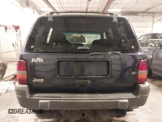 1997 Jeep Grand Cherokee Laredo with VIN 1J4GZ58S8VC675487, listed as a IAAI auction lot 41034046 with 243,284 mi miles. Bid and sale history available at carsss.com. Image 16.