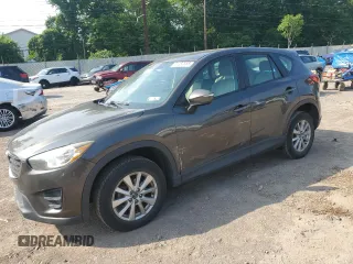 2016 Mazda CX-5 Sport with VIN JM3KE4BY9G0644800, listed as a Copart auction lot 61282555 with 137,189 mi miles and Salvage title. Bid and sale history available at DreamBid. Image 1.