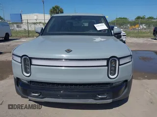 2022 Rivian R1T Adventure z VIN 7FCTGAAA2NN006053, wystawiony jako IAAI lot #41974199 z przebiegiem 286 mil mil oraz . Historia ofert i sprzedaży dostępna na DreamBid. Obrazek 6.
