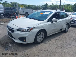 2017 Subaru Impreza Premium with VIN 4S3GTAD67H3748698, listed as a IAAI auction lot 39917558 with 56,945 mi miles. Bid and sale history available at carsss.com. Image 2.