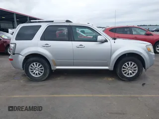 2010 Mercury Mariner Premier z VIN 4M2CN8H71AKJ14877, wystawiony jako IAAI lot #41609202 z przebiegiem 232 706 mil mil oraz . Historia ofert i sprzedaży dostępna na DreamBid. Obrazek 13.