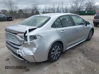 2020 Toyota Corolla Hybrid LE with VIN JTDEBRBE1LJ008409, listed as a IAAI auction lot 41948940 with 102,402 mi miles. Bid and sale history available at carsss.com. Image 4.