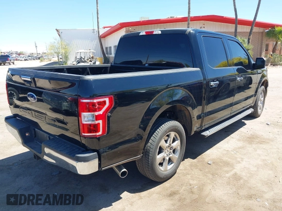 2018 Ford F-150 XL with VIN 1FTEW1C50JKF28600, listed as a IAAI auction lot 42081191 with 105,636 mi miles and . Bid and sale history available at DreamBid. Image 4.