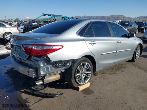 2015 Toyota Camry Hybrid LE with VIN 4T1BD1FK5FU161257, listed as a IAAI auction lot 41759927 with 116,853 mi miles. Bid and sale history available at carsss.com. Image 4.