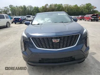 2022 Cadillac XT4 FWD Luxury z VIN 1GYAZAR47NF120348, wystawiony jako Copart lot #50187025 z przebiegiem 76 886 mil mil oraz Nie do naprawy • Non repairable. Historia ofert i sprzedaży dostępna na DreamBid. Obrazek 5.