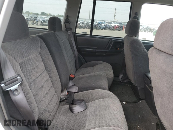 1997 Jeep Grand Cherokee Laredo with VIN 1J4GZ58S2VC676652, listed as a Copart auction lot 64939974 with 256,923 mi miles and Salvage Title. Bid and sale history available at carsss.com. Image 11.