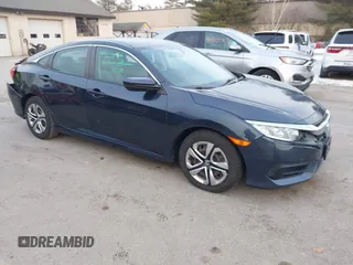 2017 Honda Civic LX z VIN 19XFC2F52HE028823, wystawiony jako IAAI lot #41312009 z przebiegiem 56 462 mil mil oraz . Historia ofert i sprzedaży dostępna na DreamBid. Obrazek 1.
