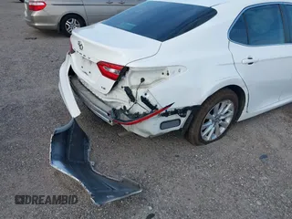 2019 Toyota Camry LE with VIN 4T1B11HK7KU806197, listed as a IAAI auction lot 41721148 with 83,373 mi miles and . Bid and sale history available at DreamBid. Image 6.