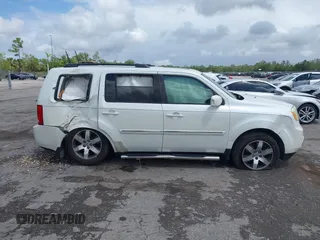 2012 Honda Pilot Touring with VIN 5FNYF3H9XCB035494, listed as a IAAI auction lot 42011362 with 271,887 mi miles and . Bid and sale history available at carsss.com. Image 14.