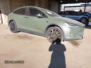 2020 Tesla Model X Long Range with VIN 5YJXCDE24LF272242, listed as a IAAI auction lot 41275226 with 103,731 mi miles. Bid and sale history available at carsss.com. Image 1.