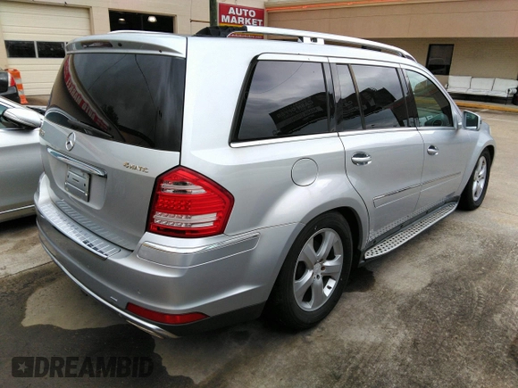 2012 Mercedes-Benz GL-Class GL 450 with VIN 4JGBF7BE1CA777189, listed as a IAAI auction lot 42201396 with 213,114 mi miles. Bid and sale history available at carsss.com. Image 4.