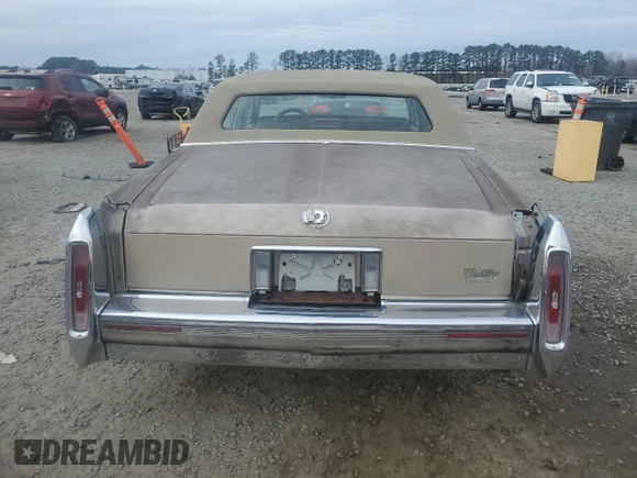 1990 Cadillac Brougham с VIN 1G6DW54Y1LR710024, выставлен на аукционе Copart как лот 88406975 с пробегом 183 170 миль миль и Чистый • Clean title. История ставок и продаж доступна на DreamBid. Изображение 6.