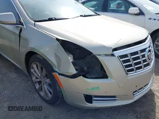 2013 Cadillac XTS Premium z VIN 2G61S5S35D9143656, wystawiony jako IAAI lot #42099511 z przebiegiem 207 055 mil mil oraz . Historia ofert i sprzedaży dostępna na DreamBid. Obrazek 6.