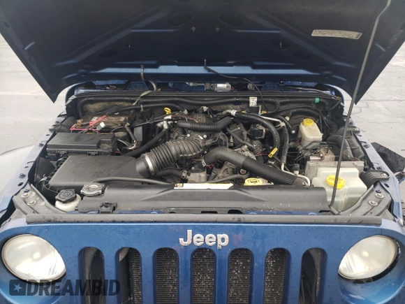 2009 Jeep Wrangler X with VIN 1J4FA24109L712701, listed as a Copart auction lot 60800855 with 156,709 mi miles and Salvage title. Bid and sale history available at DreamBid. Image 11.