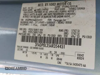 2010 Ford Fusion Hybrid with VIN 3FADP0L35AR354431, listed as a IAAI auction lot 42107722 with 142,250 mi miles. Bid and sale history available at carsss.com. Image 9.